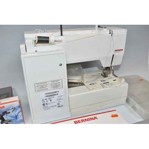 999 - A BERNINA SEWING MACHINE,  'Artista' 180 electric sewing and embroidery machine, together with manua... 