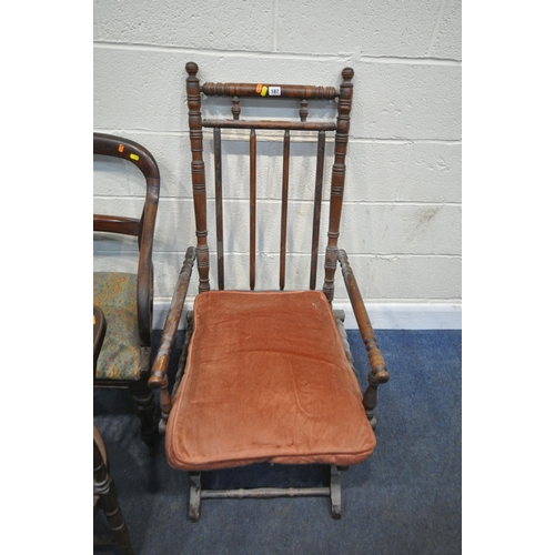 187 - AN OAK AMERICAN STYLE ROCKING CHAIR, two armchairs, a pair of rush seated chairs, two chairs with ci... 