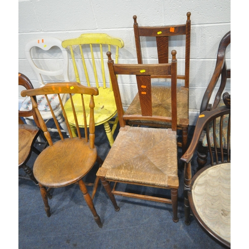 187 - AN OAK AMERICAN STYLE ROCKING CHAIR, two armchairs, a pair of rush seated chairs, two chairs with ci... 