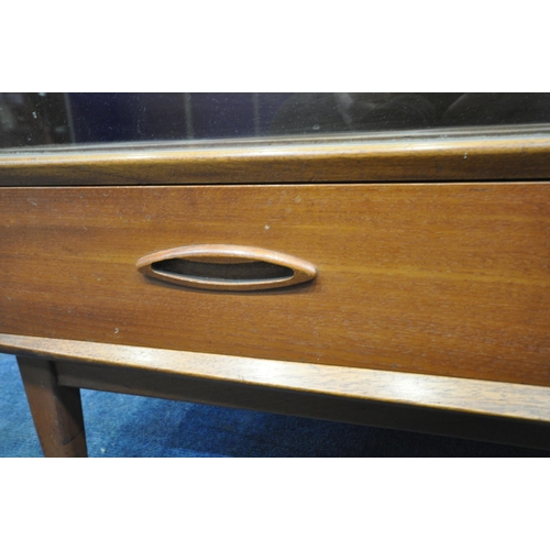 194 - A MID CENTURY TEAK BOOKCASE, with double glass sliding doors, over two drawers, width 108cm x depth ... 