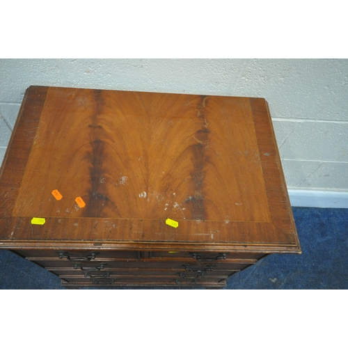 194 - A MID CENTURY TEAK BOOKCASE, with double glass sliding doors, over two drawers, width 108cm x depth ... 