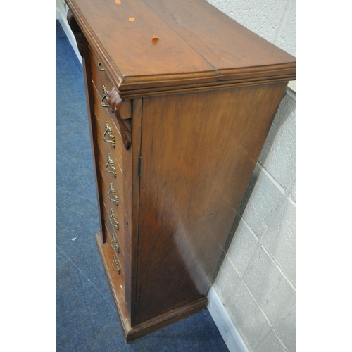 223 - A 19TH CENTURY MAHOGANY WELLINGTON CHEST, fitted with eight graduated drawers, and a hinged locking ... 