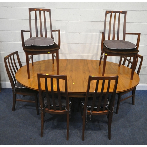 224 - WILLIAM LAWRENCE, A MID CENTURY TEAK OVAL EXTENDING DINING TABLE, with a single fold out leaf, raise... 