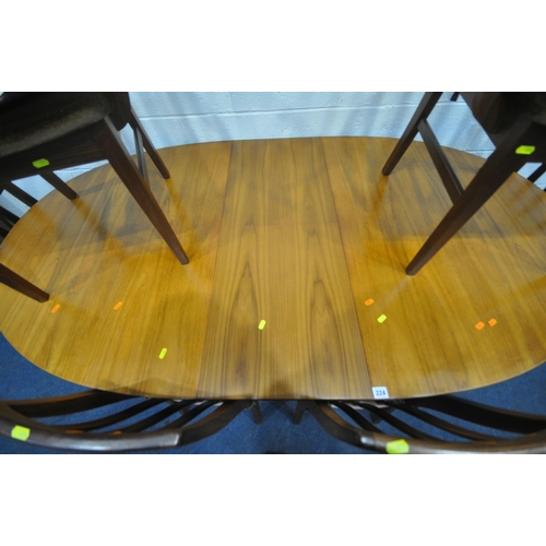 224 - WILLIAM LAWRENCE, A MID CENTURY TEAK OVAL EXTENDING DINING TABLE, with a single fold out leaf, raise... 