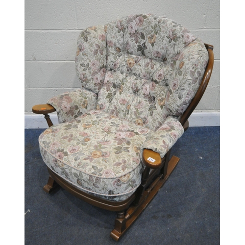 231 - A LATE 20TH CENTURY ROCKING CHAIR, with foliate upholstery, width 84cm x depth 87cm x height 100cm, ... 