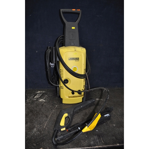 59 - A KARCHER K3.97 PRESSURE WASHER, with lance and two attachments, and a G Tech Air Ram cordless vacuu... 