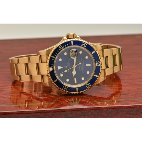 403 - AN 18CT ROLEX OYSTER PERPETUAL SUBMARINER WRISTWATCH, reference 16618, blue dial with white enamelle... 