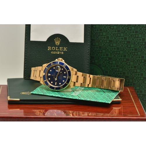 403 - AN 18CT ROLEX OYSTER PERPETUAL SUBMARINER WRISTWATCH, reference 16618, blue dial with white enamelle... 