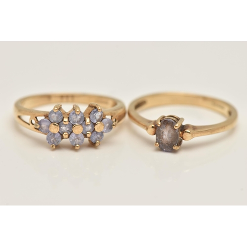 426 - TWO 9CT YELLOW GOLD GEM SET RINGS, to include a single stone iolite ring set with an oval shape mixe... 