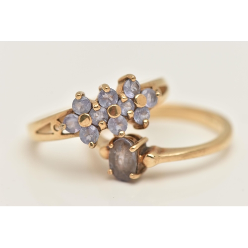 426 - TWO 9CT YELLOW GOLD GEM SET RINGS, to include a single stone iolite ring set with an oval shape mixe... 