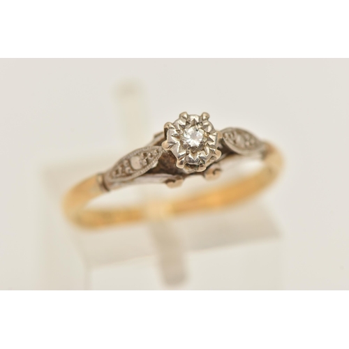 428 - A DIAMOND SINGLE STONE RING, set with a round brilliant cut diamond, to the raised white metal shoul... 