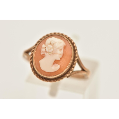 432 - A 9CT GOLD CAMEO RING, of an oval form, carved shell cameo depicting a lady in profile, milgrain col... 