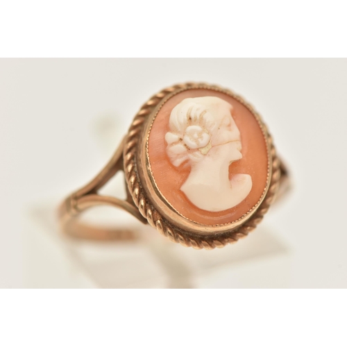 432 - A 9CT GOLD CAMEO RING, of an oval form, carved shell cameo depicting a lady in profile, milgrain col... 