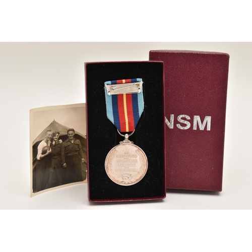 513 - A SILVER 'FOR NATIONAL SERVICES' MEDAL, inscribed 'In Recognition of Valuable Service To Your Countr... 