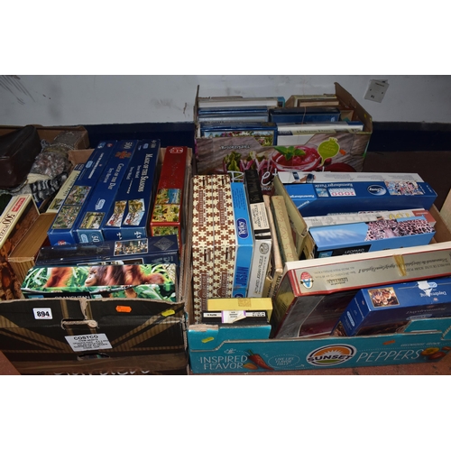 894 - THREE BOXES OF VINTAGE JIGSAW PUZZLES, to include approximately thirty boxed jigsaw puzzles, mostly ... 