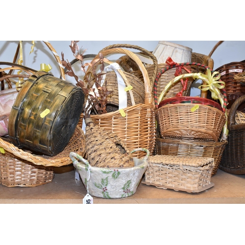 895 - A LARGE QUANTITY OF WICKER BASKETS comprising approximately thirty baskets in various forms and styl... 