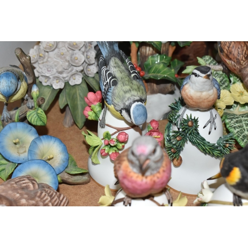 896 - A COLLECTION OF APPROXIMATELY TWENTY-FIVE VINTAGE BIRD ORNAMENTS mostly produced in collaboration wi... 