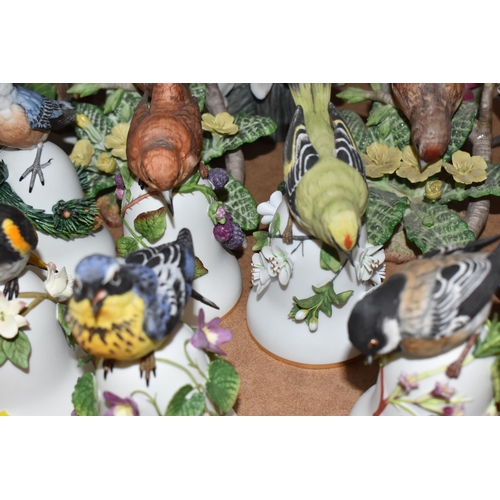 896 - A COLLECTION OF APPROXIMATELY TWENTY-FIVE VINTAGE BIRD ORNAMENTS mostly produced in collaboration wi... 