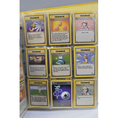 931 - A FOLDER OF POKEMON CARDS, includes cards from the Base Set, Base Set 2, Jungle, Fossil, Team Rocket... 