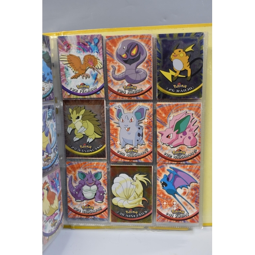 931 - A FOLDER OF POKEMON CARDS, includes cards from the Base Set, Base Set 2, Jungle, Fossil, Team Rocket... 