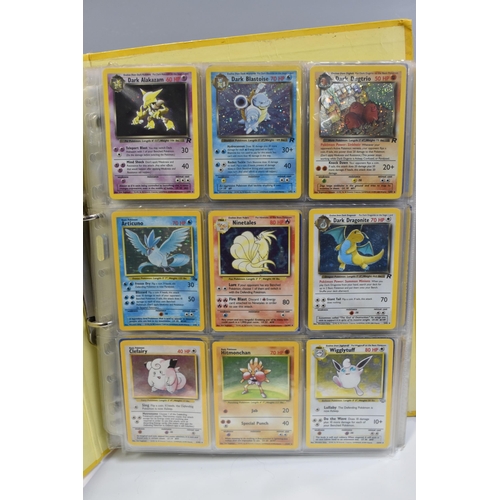 931 - A FOLDER OF POKEMON CARDS, includes cards from the Base Set, Base Set 2, Jungle, Fossil, Team Rocket... 