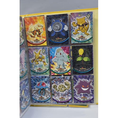 931 - A FOLDER OF POKEMON CARDS, includes cards from the Base Set, Base Set 2, Jungle, Fossil, Team Rocket... 