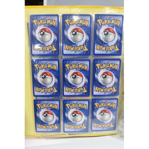 931 - A FOLDER OF POKEMON CARDS, includes cards from the Base Set, Base Set 2, Jungle, Fossil, Team Rocket... 