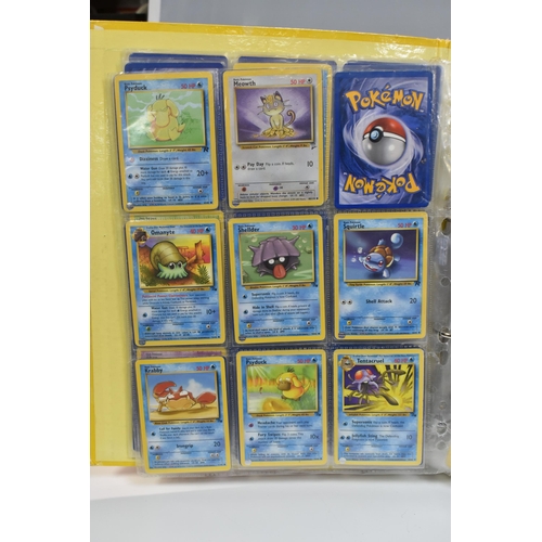 931 - A FOLDER OF POKEMON CARDS, includes cards from the Base Set, Base Set 2, Jungle, Fossil, Team Rocket... 