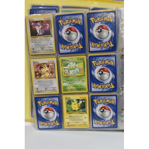 931 - A FOLDER OF POKEMON CARDS, includes cards from the Base Set, Base Set 2, Jungle, Fossil, Team Rocket... 