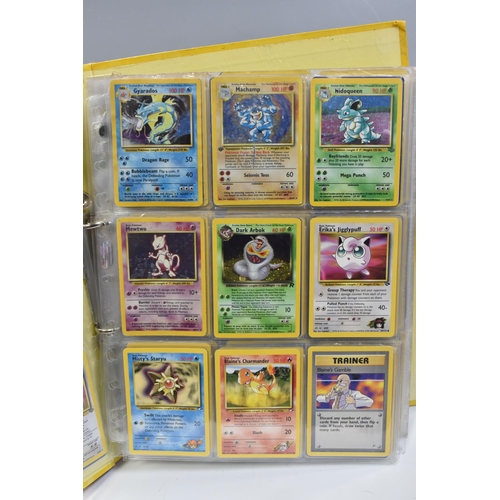 931 - A FOLDER OF POKEMON CARDS, includes cards from the Base Set, Base Set 2, Jungle, Fossil, Team Rocket... 