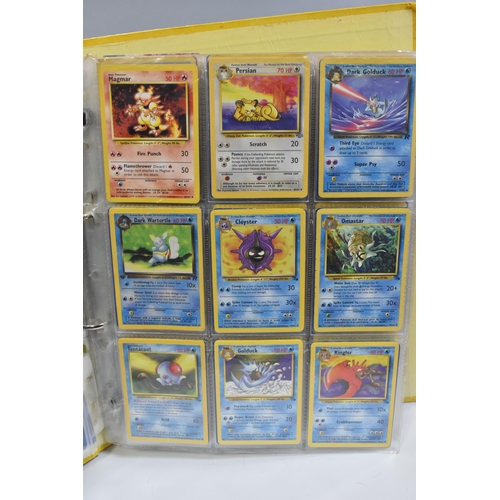 931 - A FOLDER OF POKEMON CARDS, includes cards from the Base Set, Base Set 2, Jungle, Fossil, Team Rocket... 