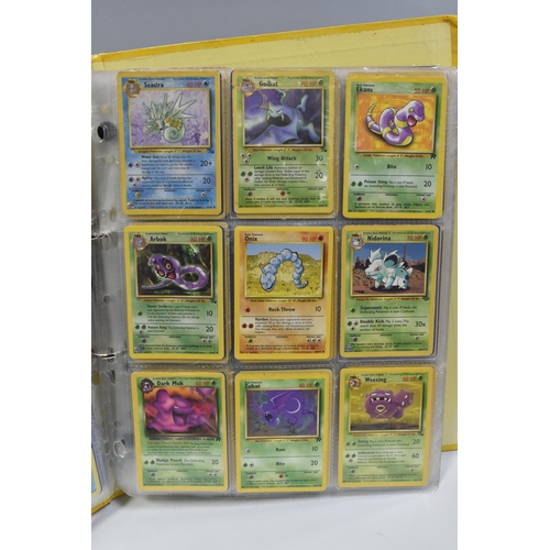 931 - A FOLDER OF POKEMON CARDS, includes cards from the Base Set, Base Set 2, Jungle, Fossil, Team Rocket... 