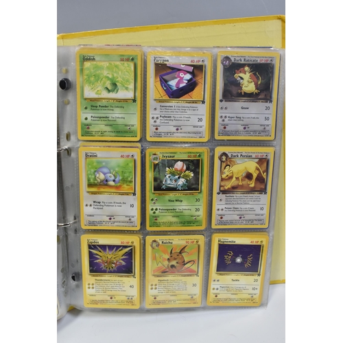 931 - A FOLDER OF POKEMON CARDS, includes cards from the Base Set, Base Set 2, Jungle, Fossil, Team Rocket... 