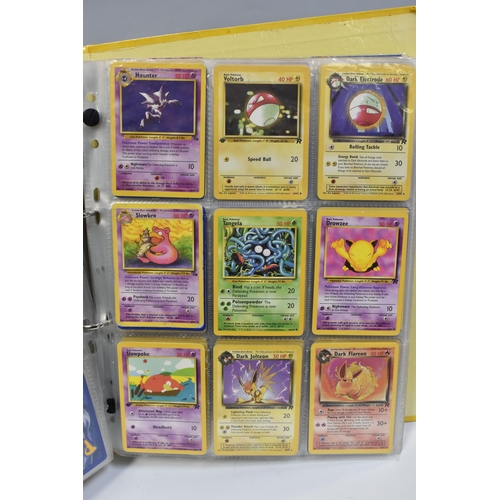 931 - A FOLDER OF POKEMON CARDS, includes cards from the Base Set, Base Set 2, Jungle, Fossil, Team Rocket... 