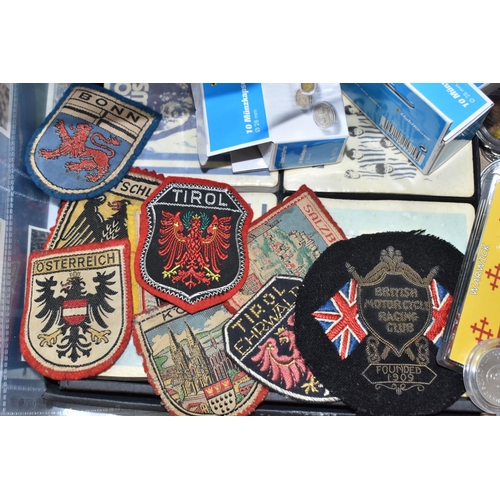 939 - THREE BOXES OF MISCELLANEOUS SUNDRIES to include a assorted vintage sew-on badges from various Europ... 