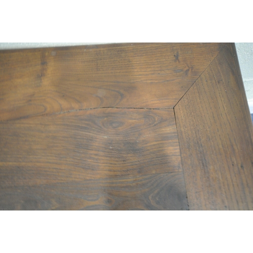 152 - A 20TH CENTURY OAK RECTANGULAR COFFEE TABLE, the sliding top enclosing storage, raised on turned leg... 