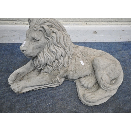 154 - AN OPPOSING PAIR OF COMPOSITE COUCHANT LION FIGURES, length approximately 65cm, condition report: go... 