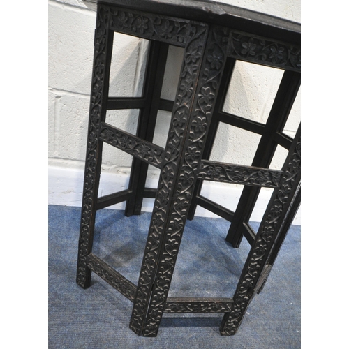 155 - A 20TH CENTURY EBONISED OAK OCTAGONAL ANGLO INDIAN TABLE, with intricate carved details all over, di... 