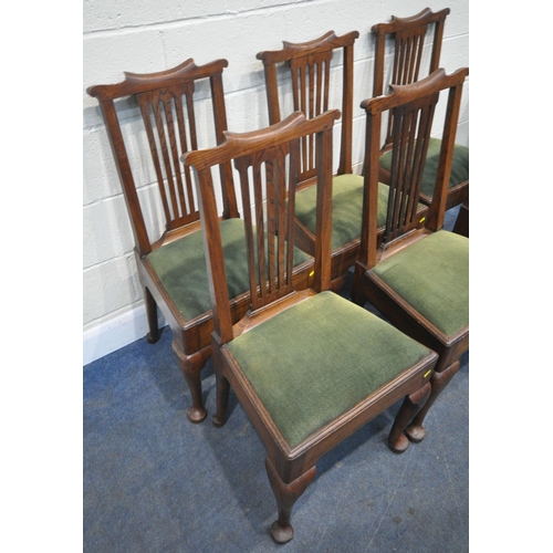 157 - A SET OF SIX GEORGIAN OAK DINING CHAIRS, with shaped crest, central splat back, green upholstered se... 