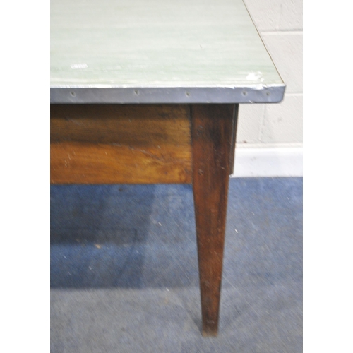 158 - A FRENCH ELM FARMHOUSE STYLE TABLE, with a Formica top, a single drawer to one end, raised on square... 