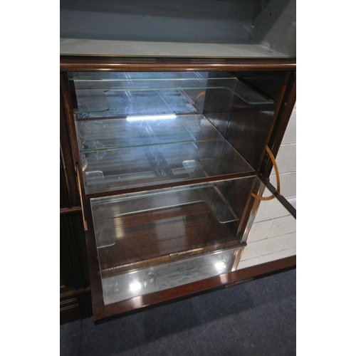 160 - A 20TH CENTURY MAHOGANY SECTIONAL CABINET, fitted with double bevelled glass hide and fall doors, do... 