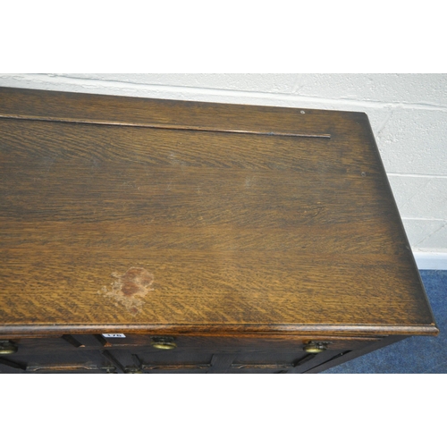 176 - A 20TH CENTURY OAK SIDEBOARD, fitted with two drawers, over double cupboard doors, width 105cm x dep... 