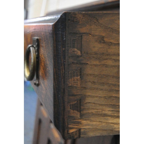 176 - A 20TH CENTURY OAK SIDEBOARD, fitted with two drawers, over double cupboard doors, width 105cm x dep... 