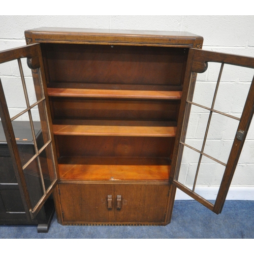 177 - A 20TH CENTURY OAK BOOKCASE, with double glazed doors, over smaller cupboard doors, width 92cm x dep... 