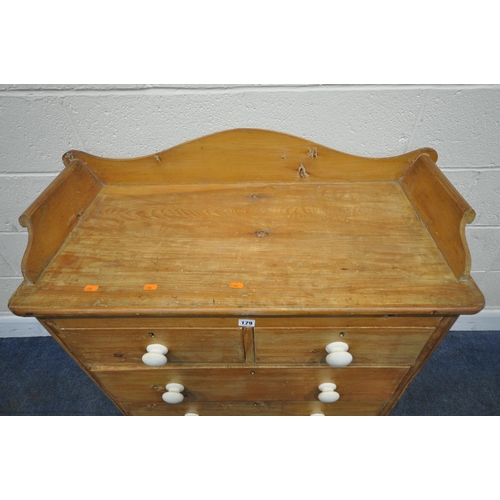 179 - A 19TH CENTURY PINE WASHSTAND, with raised back and sides, fitted with two short over two long drawe... 