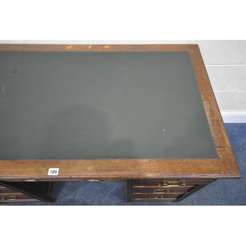 189 - A 20TH CENTURY WALNUT KNEEHOLE DESK, with a green writing surface, fitted with nine assorted drawers... 