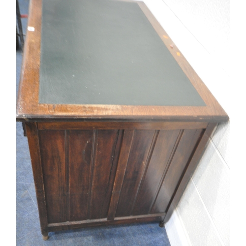 189 - A 20TH CENTURY WALNUT KNEEHOLE DESK, with a green writing surface, fitted with nine assorted drawers... 