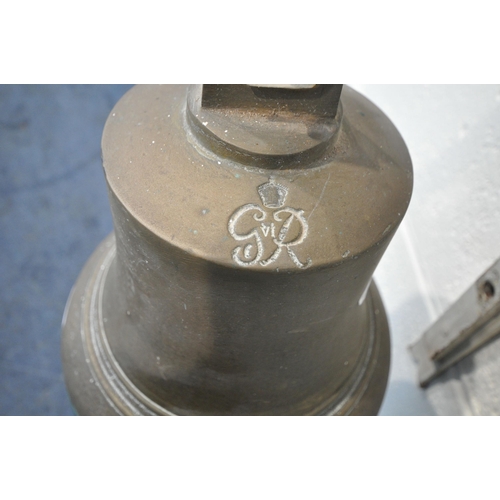 190 - A GEORGE VI BRASS BELL, engraved G R VI, with a hanging striker and rope handle, attached to a white... 