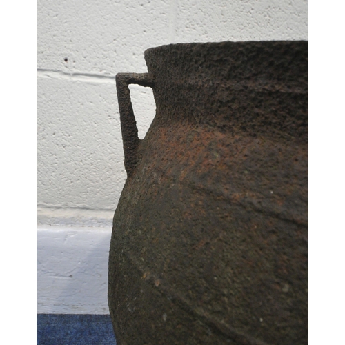 191 - A 19TH CENTURY CAST IRON CAULDRON, of a bulbous form, with twin handles, raised on three legs, appro... 