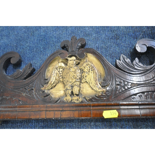 194 - A 19TH CENTURY MAHOGANY BEVELLED EDGE WALL MIRROR, the scrolled and foliate crest with a gilt bird o... 